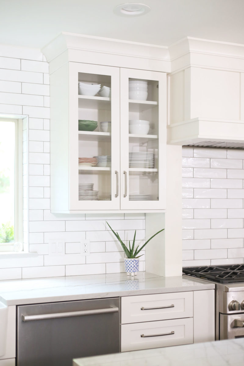 White cabinet storage, subway tile backsplash, glass wall cabinets, stainless dishwasher Kitchen Ideas Tulsa kitchen design and remodel