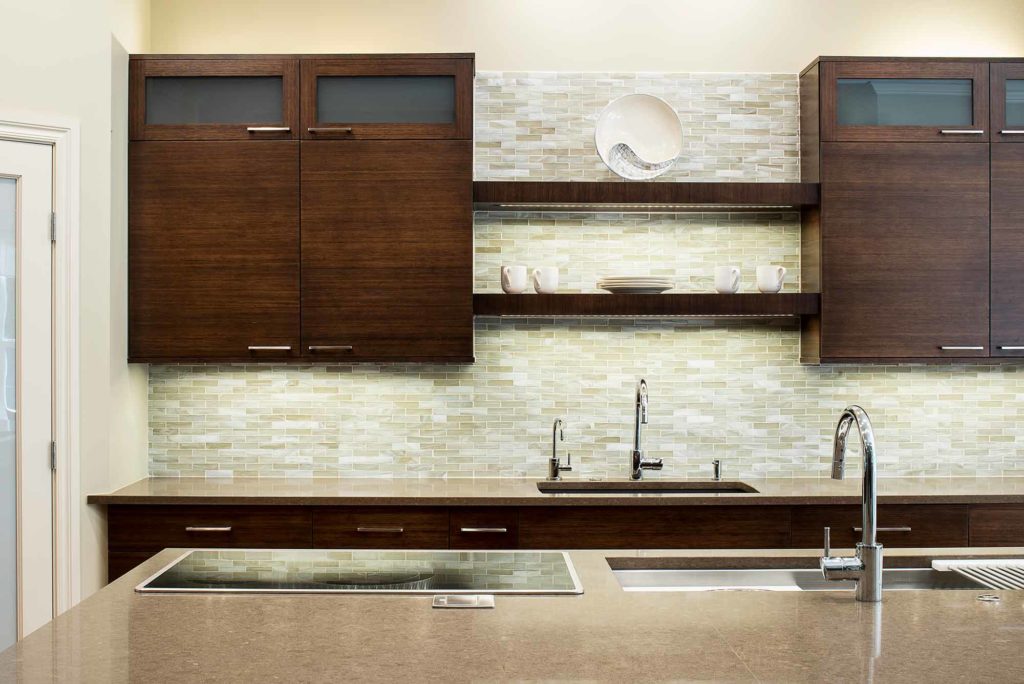 Contemporary Tulsa kitchen with bamboo cabinetry, large island with Galley Workstation large kitchen sink, induction cooktop, Blanco clean-up sink with open shelves above and bamboo wall cabinet storage