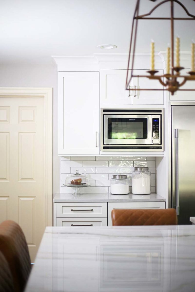Spacious Tulsa kitchen with Frigidaire wall microwave, drawer refrigerator and subway tile backsplash