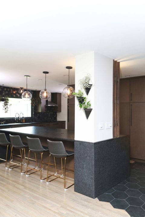 Kitchen peninsula seating with decorative pendant lights, lighted tall kitchen storage Kitchen Ideas Tulsa kitchen design and remodel