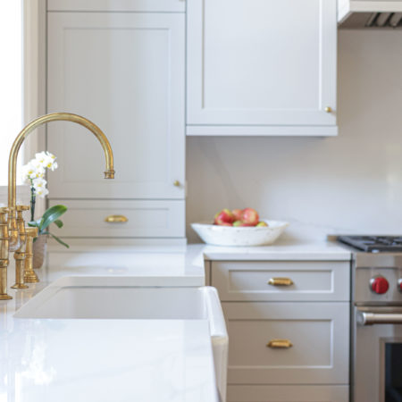 Farmhouse kitchen sink white kitchen cabinet storage and quartz counter top kitchen ideas Tulsa kitchen designer remodeler