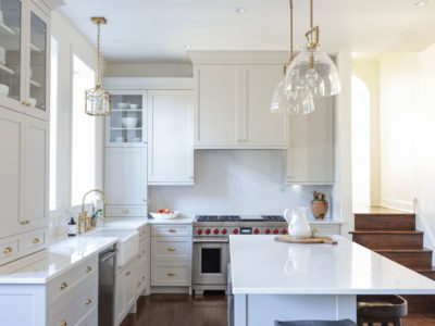Kitchen island pendant lighting with white cabinet storage, stainless dishwasher, apron-front sink Tulsa kitchen remodel