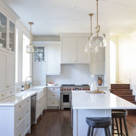Kitchen island pendant lighting with white cabinet storage, stainless dishwasher, apron-front sink Tulsa kitchen remodel