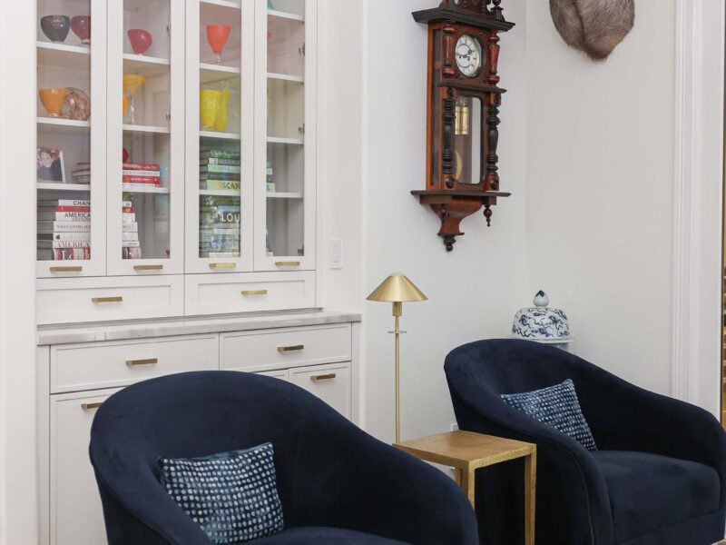 Tulsa kitchen remodel featuring tall white cabinet storage with a cozy built-in seating space.