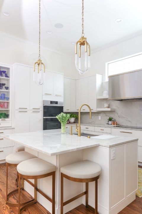 White kitchen island pendants and seating, Dacor ovens, tall pantry storage, stainless vent hood, induction cooktop Kitchen Ideas Tulsa kitchen remodel