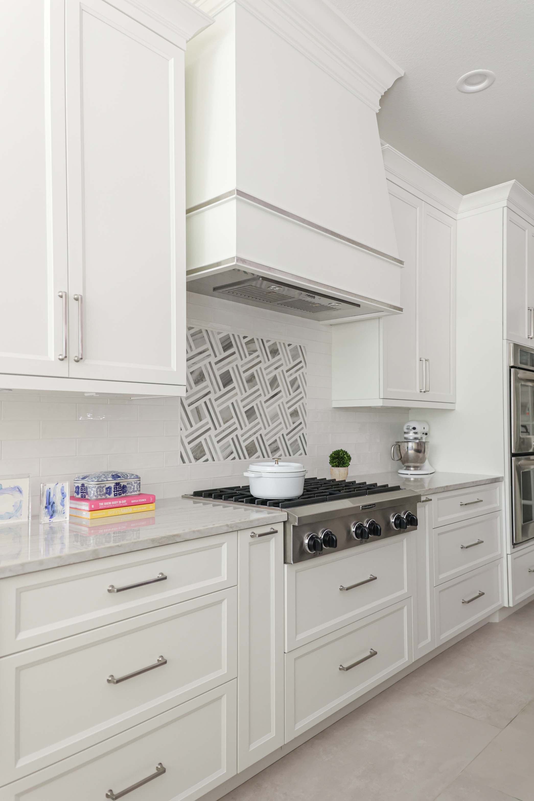 Cabinet storage Kitchenaid rangetop, decorative vent hood, tile backsplash Kitchen Ideas Tulsa kitchen design and remodel