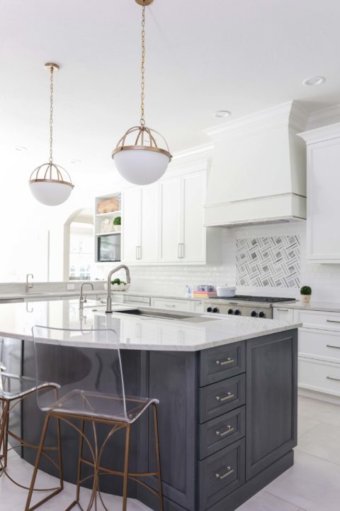 Kitchen island seating, decorative pendants, undermount kitchen sink, rangetop, decorative vent hood, white Kitchen Ideas Tulsa kitchen remodel