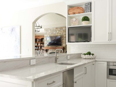 Kitchen peninsula white cabinets, undercounter ice maker, bar sink, subway tile backsplash, large crown molding Kitchen Ideas Tulsa kitchen remodel