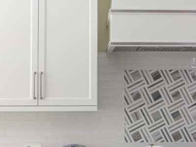 Professional kitchen rangetop with subway tile, decorative vent hood, white cabinet storage Kitchen Ideas Tulsa kitchen design remodel