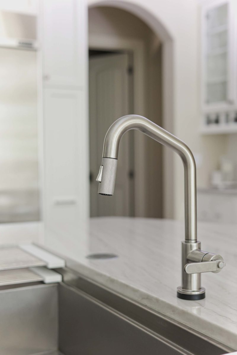 Kitchen sink workstation with pull-down faucet and white counter top Kitchen Ideas Tulsa kitchen design and remodel