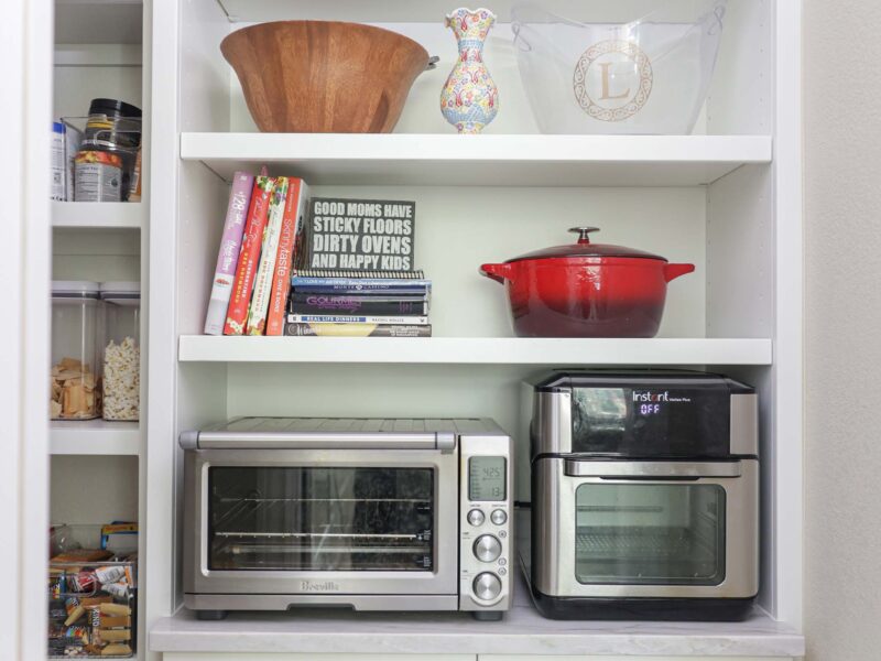 Tulsa kitchen remodel featuring a tall storage unit with open shelving and full-size base cabinet doors.