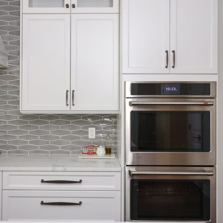 Kitchen double ovens, white kitchen cabinet storage, decorative tile backsplash, crown molding Kitchen Ideas Tulsa kitchen remodel