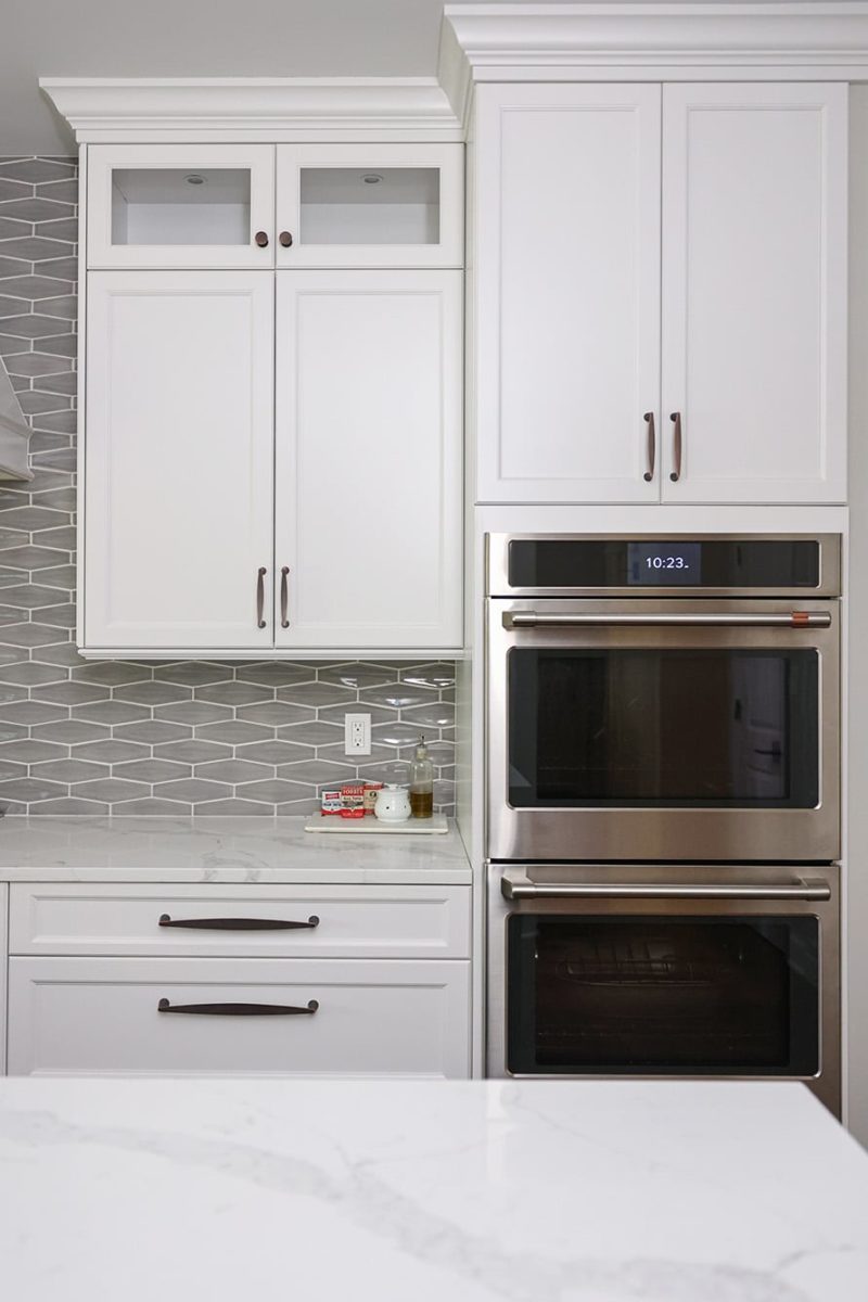 Kitchen double ovens, white kitchen cabinet storage, decorative tile backsplash, crown molding Kitchen Ideas Tulsa kitchen remodel