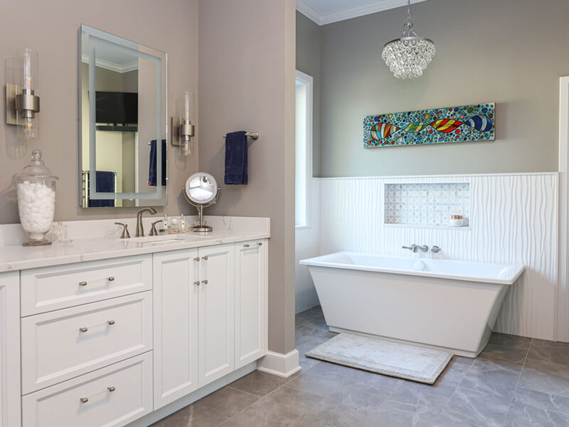 A comprehensive Tulsa home remodel featuring modern bathroom vanities, a luxurious freestanding tub, and inspiring kitchen design ideas.