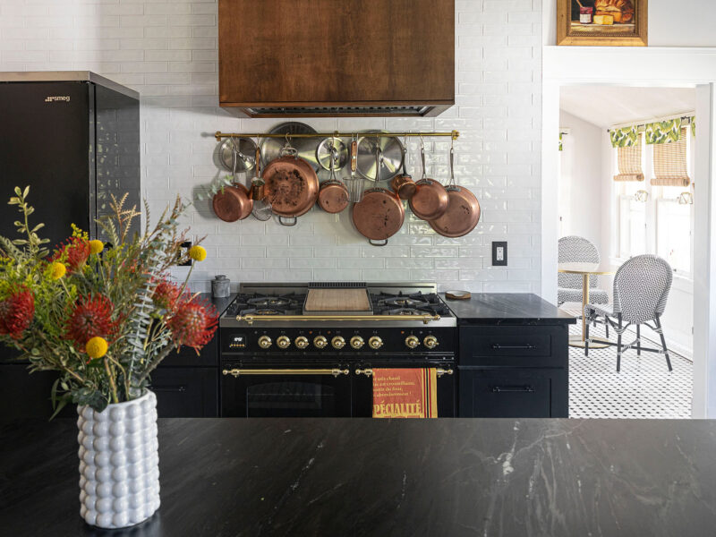 Tulsa kitchen design and remodel featuring a French range and black cabinet storage.