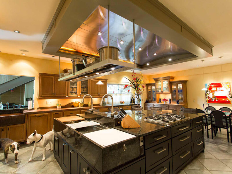 Tulsa kitchen remodel and design featuring an open old-world kitchen with an island, a Galley Workstation, and dark cabinet drawer storage.