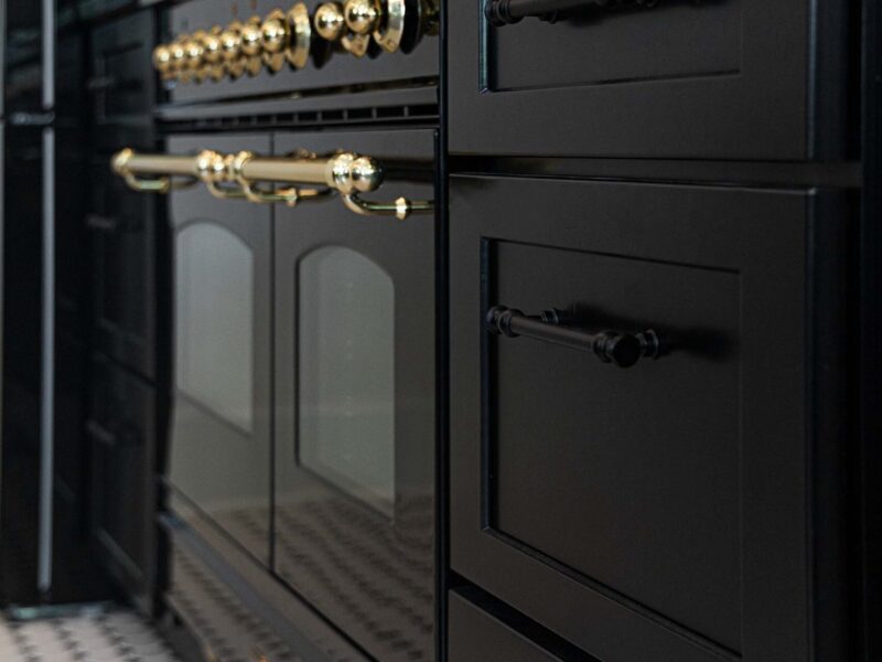 Tulsa kitchen design and remodel featuring kitchen cabinets and a french range in a black finish.