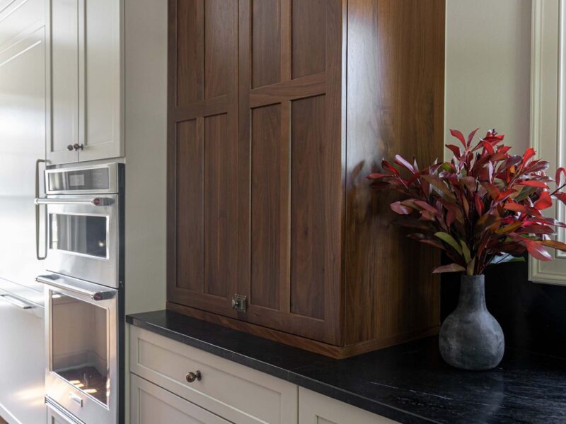 Tulsa kitchen design and remodel featuring double ovens, a natural wood countertop cabinet storage with extensive storage with crown molding on the cabinets.