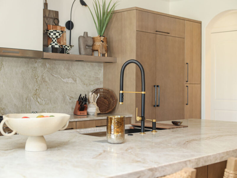Tulsa kitchen remodel with an ideal workstation island. The design features a Galley sink, thick counters, and tall storage cabinets.